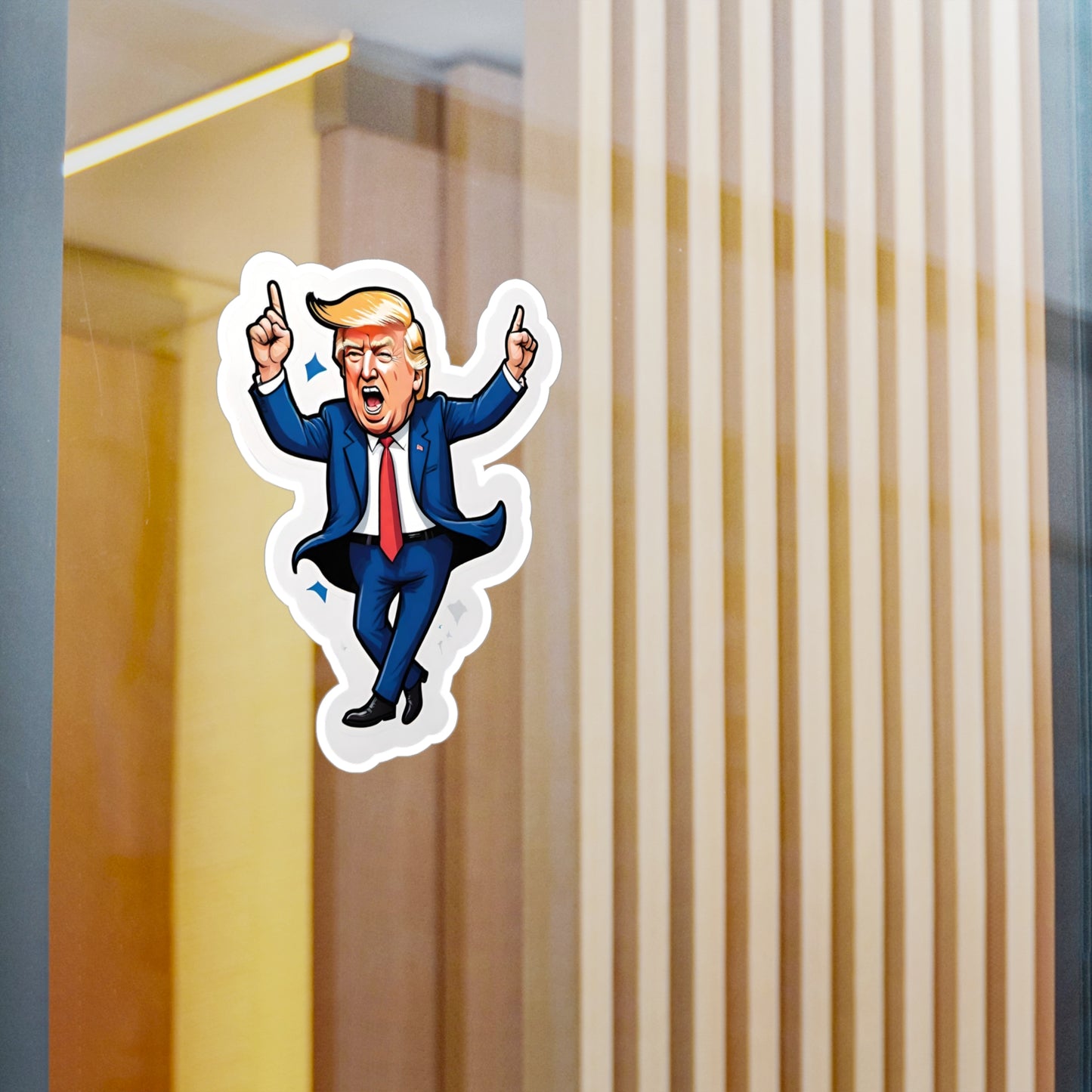 Vinyl car decal of a cartoon looking Donald Trump, dancing with his hands in the air displayed on a window