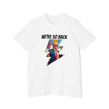 White T-shirt featuring a dynamic graphic design with a stylized image of Donald Trump in a suit and red tie, standing with his arms outstretched. Above the image, the text reads 'WE'RE SO BACK' in bold black letters