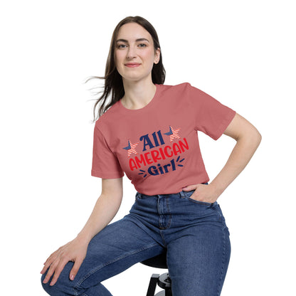 Woman wearing a pink T-shirt with 'All American Girl' text in red and blue, featuring two American flag stars above the text.