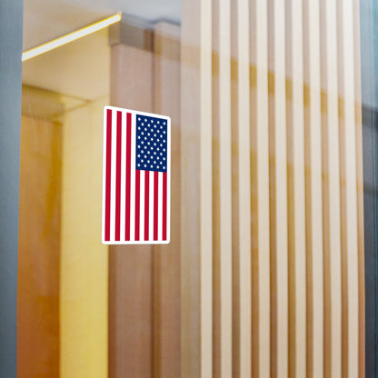 A USA flag sticker displayed on a window