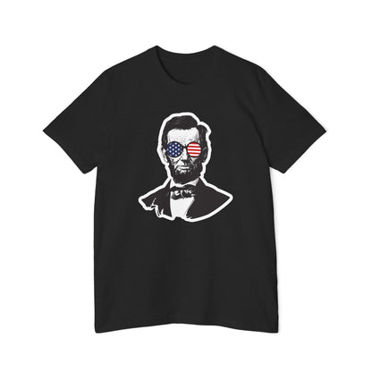 Black T-shirt featuring a stylized portrait of Abraham Lincoln wearing sunglasses with the American flag reflected in the lenses