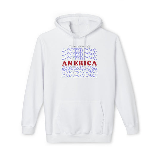 White hoodie with a repeating 'America' text design in blue, with the central 'America' text in bold red. The phrase 'United States Of' is written in a cursive style above the text