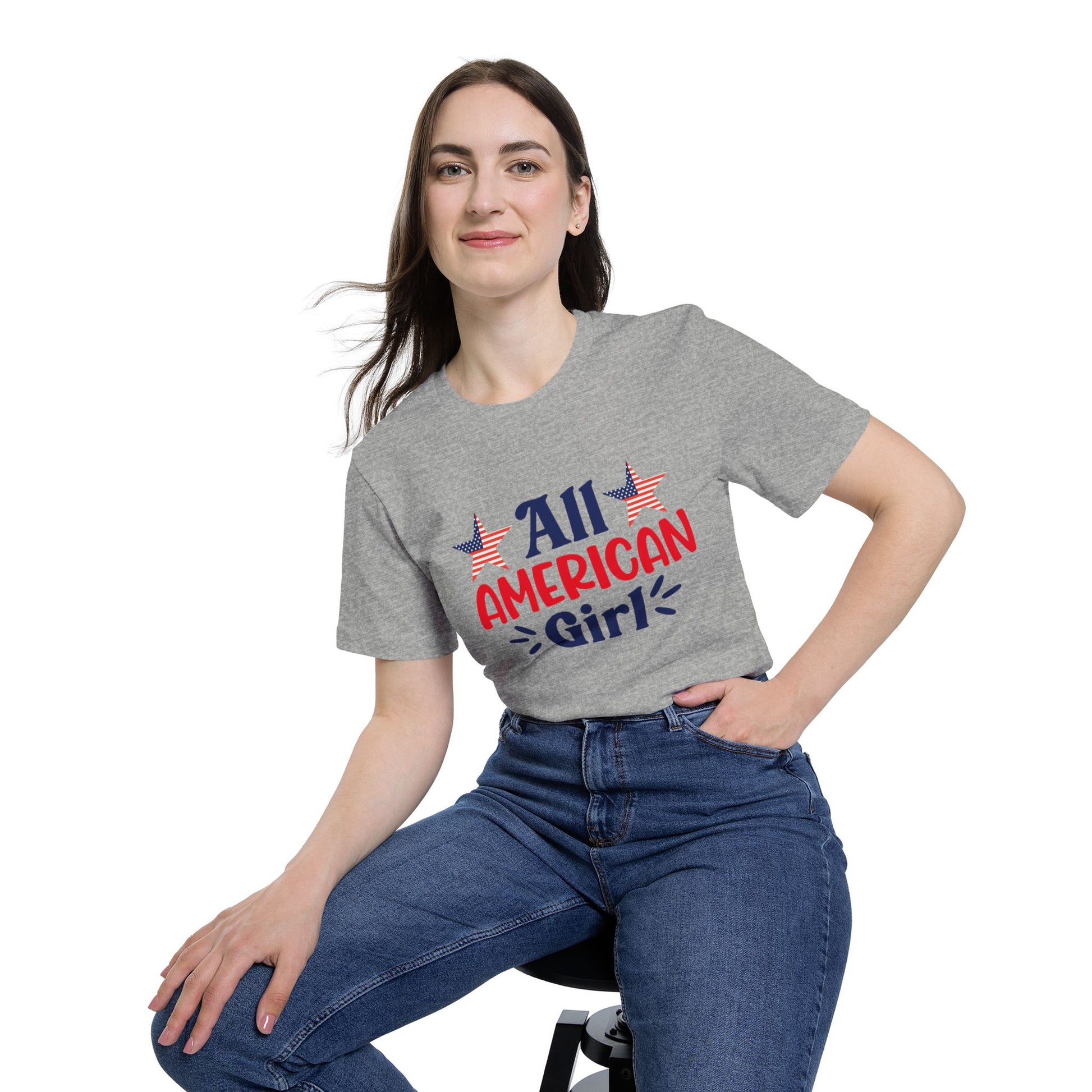 Woman wearing a gray T-shirt with 'All American Girl' text in red and blue, featuring two American flag stars above the text.