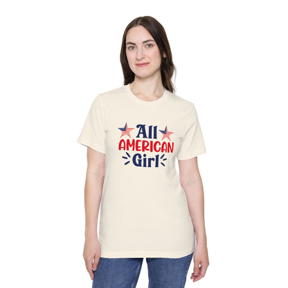 Woman wearing a beige T-shirt with 'All American Girl' text in red and blue, featuring two American flag stars above the text.