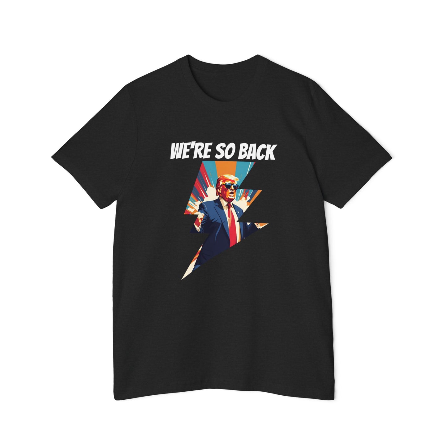 Black T-shirt featuring a dynamic graphic design with a stylized image of Donald Trump in a suit and red tie, standing with his arms outstretched. Above the image, the text reads 'WE'RE SO BACK' in bold white letters